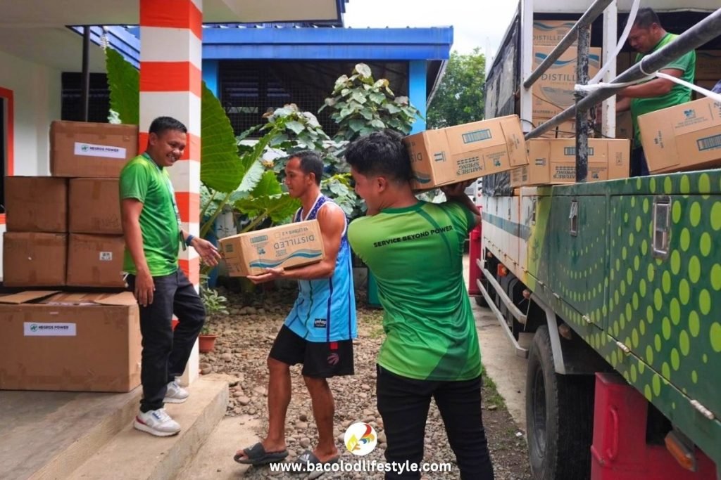 Negros Power staff unloading of relief packages