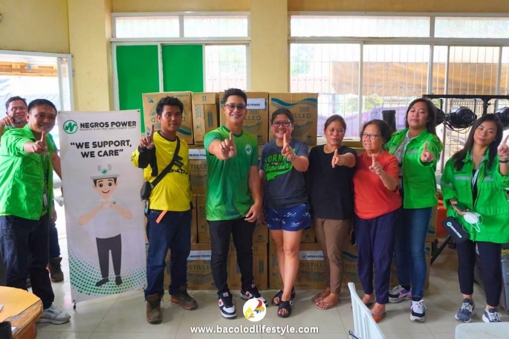 Negros Power staff with Bago Residents